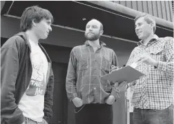  ?? GERRY KAHRMANN/ PNG ?? Reid Blakley, Sean Ramsay and Ryan McCormick converse outside the Biltmore Cabaret on Wednesday. They are part of a group that is circulatin­g a petition to urge the B. C. government to rescind a recent liquor law rule that restricts access by minors to...
