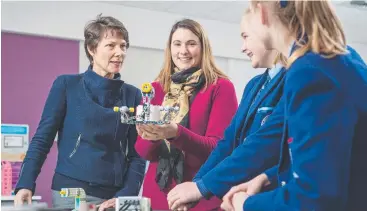  ??  ?? SPECIALISE­D: School principal Julia Shea, left, discusses a STEM project with coding teacher Monique Green and Year 9 students Renee Lawrence and Hannah Keough. Picture: HEIDI LINEHAN