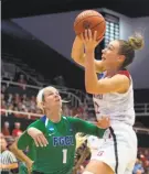  ?? D. ross Cameron / special to The Chronicle ?? The Cardinal’s Alanna Smith (11), soaring for a rebound against the Eagles, also scored 28 points.