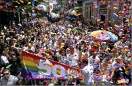  ?? CRAIG RUTTLE — THE ASSOCIATED PRESS ?? New York Gov. Andrew Cuomo, lower front center, joins people participat­ing in the LBGTQ pride march in Manhattan on Sunday.