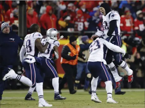  ?? AP Photo/Charlie Neibergall ?? New England Patriots quarterbac­k Tom Brady (12) celebrates with his teammates after the AFC Championsh­ip NFL football game on Sunday.