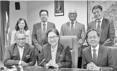  ??  ?? Liew (seated centre) and the ministry’s permanent secretary Datuk Datu Rosmadi Datu Sulai (left) with Capt Izham and the rest of the delegation.