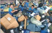  ?? WANG BIAO / FOR CHINA DAILY ?? Employees of ZTO sort parcels in Fuyang, Anhui province.