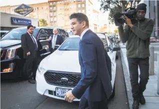  ?? David Paul Morris / Bloomberg ?? Travis Kalanick, co-founder and former CEO of Uber, leaves the courthouse in San Francisco Wednesday after testifying in the Waymo case accusing Uber of stealing technology.