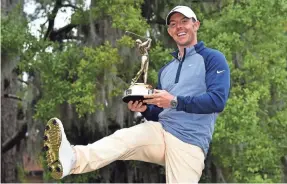  ?? JASEN VINLOVE/USA TODAY SPORTS ?? Rory McIlroy celebrate winning his first Players Championsh­ip title Sunday at the TPC Sawgrass Stadium Course.