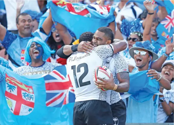  ?? Photo: World Rugby ?? Fiji Airways Fijian 7s reps Vatemo Ravouvou and captain Seremaia Tuwai celebrate after defeating New Zealand in the cup semi final 14-12.