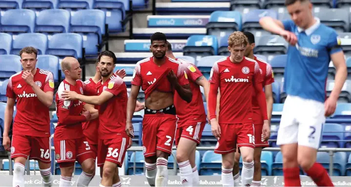  ?? Kieran Cleeves ?? ● Stanley’s Adam Phillips, centre, celebrates scoring what proved to be the winning goal against Portsmouth at Fratton Park on Sunday