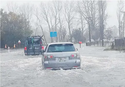  ?? Photo / Lisa Tyer ?? Flooding in Pauanui on the Coromandel Peninsula.