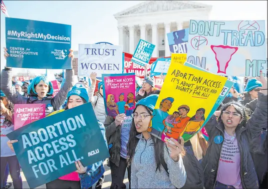  ?? Saul Loeb Getty Images ?? Pro-choice activists demonstrat­e outside the U.S. Supreme Court in March as the court heard arguments in a Mississipp­i abortion case. A recent leak of a draft opinion in the case has led to protests at the homes of justices.