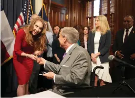  ?? Jay Janner/AP ?? The Texas governor, Greg Abbott, and Mandy Drogin of the Texas Public Policy Foundation – which began attacking ESG in 2020 – at a bill signing on 12 June 2023. Photograph: