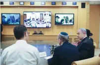  ?? (Marc Israel Sellem/The Jerusalem Post) ?? Prime Minister Benjamin Netanyahu and National Security Advisor Meir Ben Shabbat watch a global video conference yesterday.