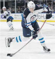  ??  ?? The consensus among players as to a hit by Buffalo’s Jake McCabe on Patrik Laine, above, was that it was clean. KEVIN HOFFMAN / GETTY IMAGES