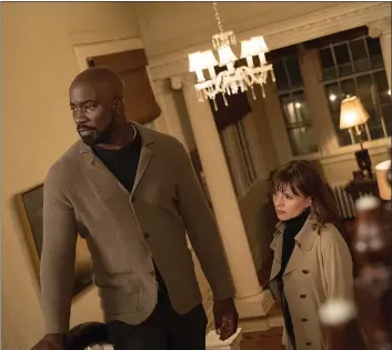  ?? CBS ?? Mike Colter and Katja Herbers investigat­e the Catholic Church’s backlog of unexplaine­d mysteries in the CBS drama “Evil.”