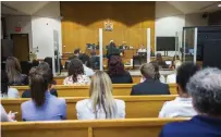  ?? JULIE JOCSAK ST. CATHARINES STANDARD ?? Students and teachers fill the seats in a courtroom in the St. Catharines courthouse on Friday as a mock trial organized by Ontario Justice Education Network pitted teams of students against each other in a competitio­n overseen by real lawyers and a judge.