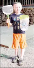  ?? Keith Bryant/The Weekly Vista ?? Nolen Wade, 6, stands showing off his net and pitcher of fireflies during last Saturday’s Fireflies and Tailgating event at Blowing Springs.