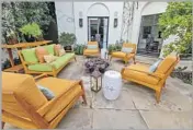  ??  ?? A LOUNGE area outside the house’s family room offers plenty of seating around the fire bowl.