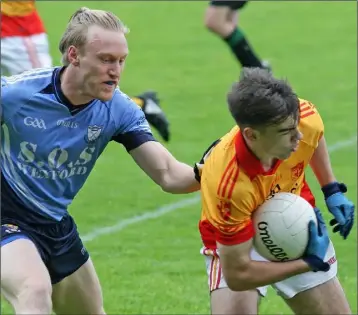  ??  ?? Dylan Furlong of Sarsfields shields the ball from St. Anne’s defender Diarmuid O’Keeffe.