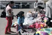  ?? PICTURE: EPA ?? People displaced by the fires pick up supplies and clothes that were donated by Piner Cafe and the community in Santa Rosa, California.