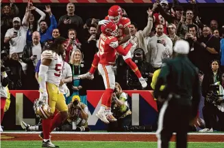 ?? John Locher/Associated Press ?? Kansas City Chiefs quarterbac­k Patrick Mahomes (15) celebrates with wide receiver Mecole Hardman Jr. (12) after Hardman scored the game-winning touchdown against the San Francisco 49ers in overtime during Super Bowl 58 on Sunday in Las Vegas. The Chiefs won 25-22. Mahomes orchestrat­ed a double digit come-from-behind Super Bowl win for the third time.