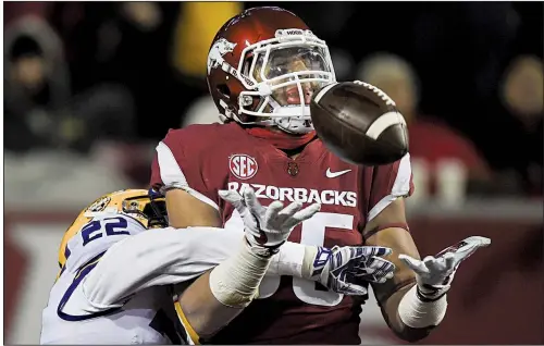  ?? NWA Democrat-Gazette/CHARLIE KAIJO ?? LSU cornerback Kristian Fulton breaks up a pass intended for Arkansas tight end Cheyenne O’Grady during the second quarter Saturday at Reynolds Razorback Stadium in Fayettevil­le. The Razorbacks lost 24-17 to fall to 2-8 overall and 0-6 in the SEC.