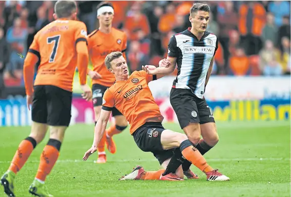  ?? Picture: SNS. ?? Paul Watson tackles Kyle Magennis in the Premiershi­p Play-Off Final first leg against St Mirren at Tannadice last May.