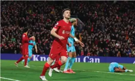  ?? Photograph: Lynne Cameron/EPA ?? Diogo Jota celebrates his goal while Isaac Hayden lies on the ground. Eddie Howe claimed his player was dazed afterwards, but Hayden stayed on.