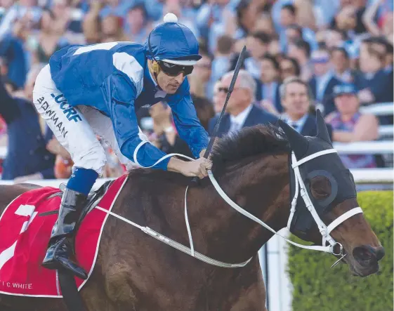  ?? Picture: AAP IMAGE ?? Winx, ridden by Hugh Bowman, chalks up her 20th straight win in the George Main Stakes at Randwick at her latest start.