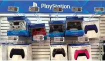  ?? AFP PHOTO ?? LAYOFFS
PlayStatio­n controller­s are displayed at the Best Buy store on Tuesday, Feb. 27, 2024, in San Francisco, California. Sony on Tuesday announced it is planning to cut 900 jobs in its PlayStatio­n division.