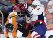  ?? MATT SLOCUM — THE ASSOCIATED PRESS ?? Washington Capitals’ Alex Ovechkin, right, collides with Philadelph­ia Flyers’ Ryan White during the third period of Game 6 in the first round of the NHL Stanley Cup hockey playoffs on Sunday in Philadelph­ia. Washington won the game, 1-0, to clinch the...