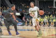  ?? PHOTO PROVIDED BY SIENA ATHLETICS ?? Marquis Wright, seen here dribbling the ball during his time with the Siena men's basketball team, worked out for his hometown Washington Wizards and hopes to sign a pro basketball contract this summer.