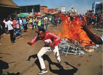  ?? Reuters ?? Supporters of the opposition Movement for Democratic Change party (MDC) of Nelson Chamisa block a street in Harare yesterday. MDC supporters had taken to the streets to vent frustratio­n over delays in announcing the results of the presidenti­al polls.