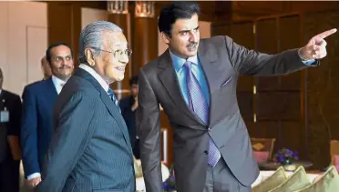  ??  ?? Foreign opportunit­y: Dr M showing Sheikh Tamim around his office in Perdana Putra, during his visit to Malaysia.