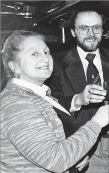  ?? 01_B24obit01 ?? Pauline Muir raises a toast to Arran with Howard Driver of The Arran Banner in a photograph from 1983.