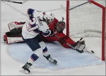  ?? JAE C. HONG — THE ASSOCIATED PRESSD ?? The United States’ Hilary Knight scores against Canada goaltender Annrenee Desbiens during the women’s gold medal game Thursday.