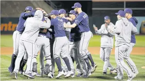  ?? USA TODAY SPORTS ?? The Tampa Bay Rays celebrate after defeating the Oakland Athletics.