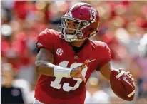  ?? KEVIN C. COX / GETTY IMAGES ?? Alabama quarterbac­k Tua Tagovailoa, who rallied the Crimson Tide in the national title game against UGA last season, is completing 70.4 percent of his passes with 25 TDs and no picks.