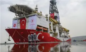  ?? Photograph: Bülent Kılıç/AFP via Getty ?? Turkish police officers patrol next to the Yavuz drillship, which was scheduled to search for oil and gas off Cyprus earlier this year.