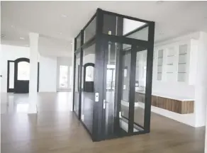  ??  ?? This elevator features a glass cab and hoistway for a modern feel.