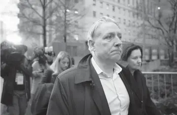  ?? JOHN MINCHILLO AP ?? Former FBI agent Charles McGonigal leaves court Monday in New York. McGonigal worked to have Oleg Deripaska’s sanctions lifted in 2019 and took money from him in 2021 to investigat­e a rival oligarch, the Justice Department said.