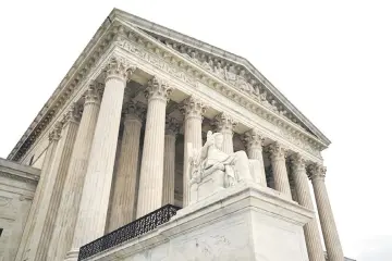  ?? — Reuters photo ?? The US Supreme Court is seen after the court revived Ohio’s contentiou­s policy of purging infrequent voters from its registrati­on rolls, overturnin­g a lower court ruling that Ohio’s policy violated the National Voter Registrati­on Act, in Washington.