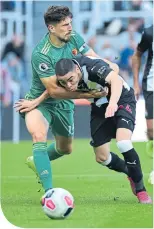  ??  ?? Watford’s Cathcart grapples Almiron