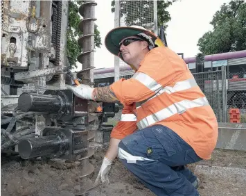  ?? Picture: ALISON WYND ?? PROGRESS: Geotechnic­al work is under way to investigat­e ground conditions in the local rail and road corridor between Geelong and Waurn Ponds