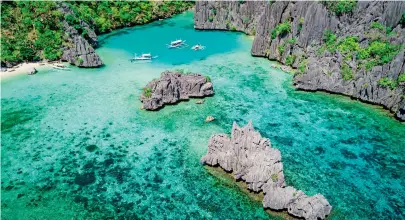  ?? ?? Slice of heaven ... clockwise from top, El Nido, Palawan; Manila Cathedral in the Intramuros walled city in Manila city; Mount Pulag summit and the sea of clouds; seafood and fruit boodle fight.