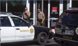  ??  ?? Austin Dave /The Signal Sheriff’s deputies investigat­e a reported robbery at a Bank of America on the 26500 block of Golden Valley Road in Canyon Country on Friday.