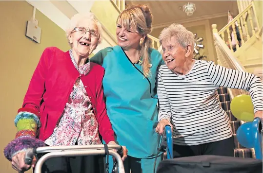  ??  ?? Natalie Driscoll, who works at Braehill Lodge in Carnoustie, has been named Scottish Carer of the Year. The 41-year-old is pictured with residents Margaret Cherry and Margaret Soave. Picture: Mhairi Edwards.