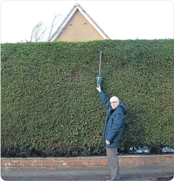  ??  ?? Douglas keeps his hedge magnificen­tly manicured – when he has the tools for it!