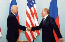  ?? ALEXANDER ZEMLIANICH­ENKO/AP ?? Then-Vice President Joe Biden shakes hands with Russian President Vladimir Putin in Moscow in 2011. Now president and coming off the G-7 summit in England, Biden is scheduled to meet Putin one-on-one later this week in Geneva.