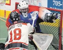  ?? CLIFFORD SKARSTEDT EXAMINER ?? Peterborou­gh Lakers goalie Doug Buchan makes a huge glove save on Brooklin Redmen’s Connor Kearnan onJune 14 at the Memorial Centre.