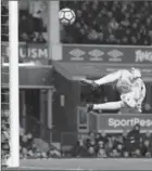  ?? JAN KRUGER, GETTY IMAGES ?? Juan Mata of Manchester hits the post as goalie Jordan Pickford of Everton looks back.