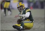  ?? AARON GASH — THE ASSOCIATED PRESS ?? The Green Bay Packers’ Aaron Rodgers reacts after being sacked by the San Francisco 49ers’ Arik Armstead during the second half of an NFC divisional playoff game Saturday in Green Bay, Wis.